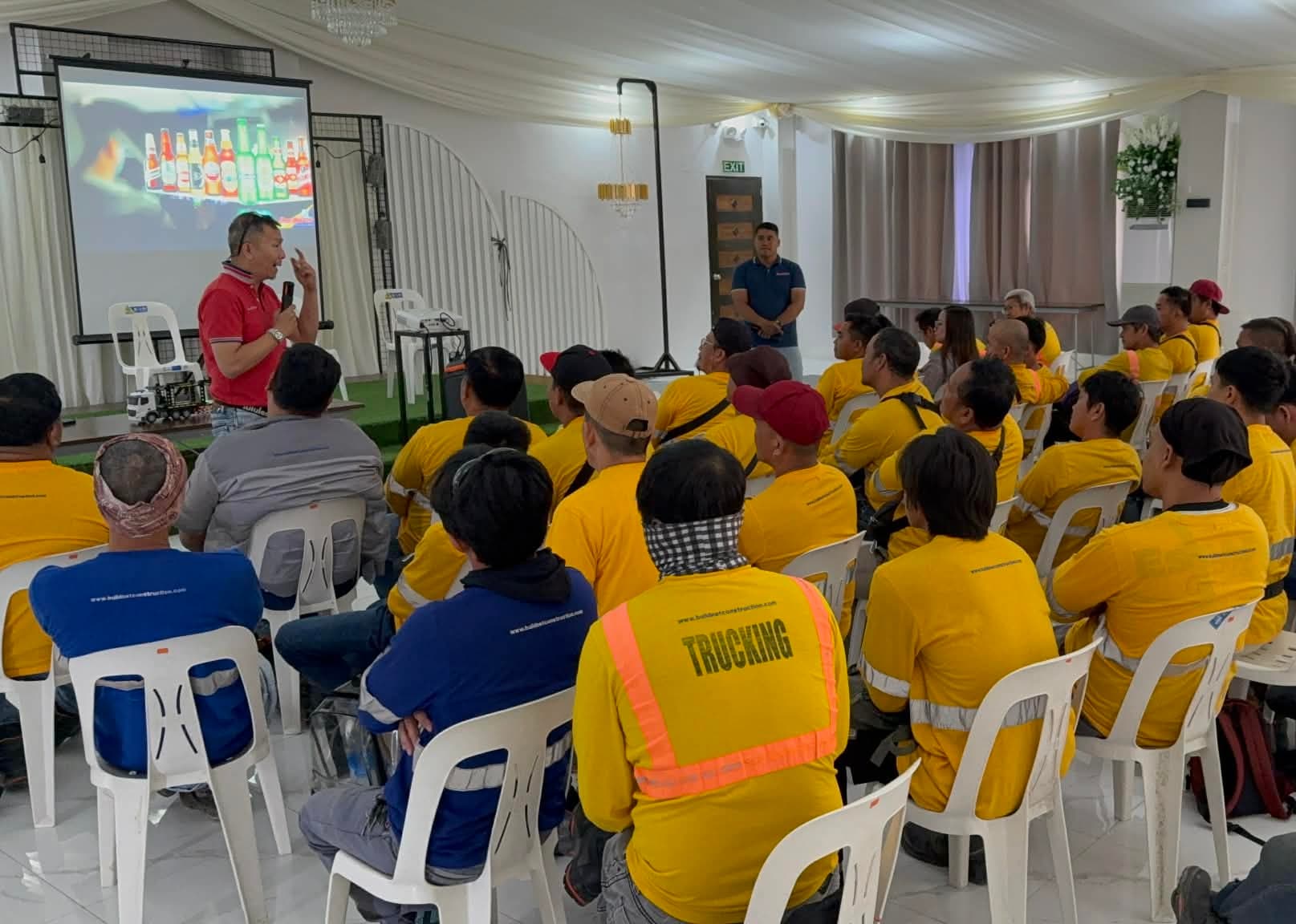 A PDSA instructor leading a classroom session for a group of truck drivers